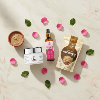 Clear Skin Combo flat lay - Multani Mitti, Rose Water and Moisturizer with rose petals